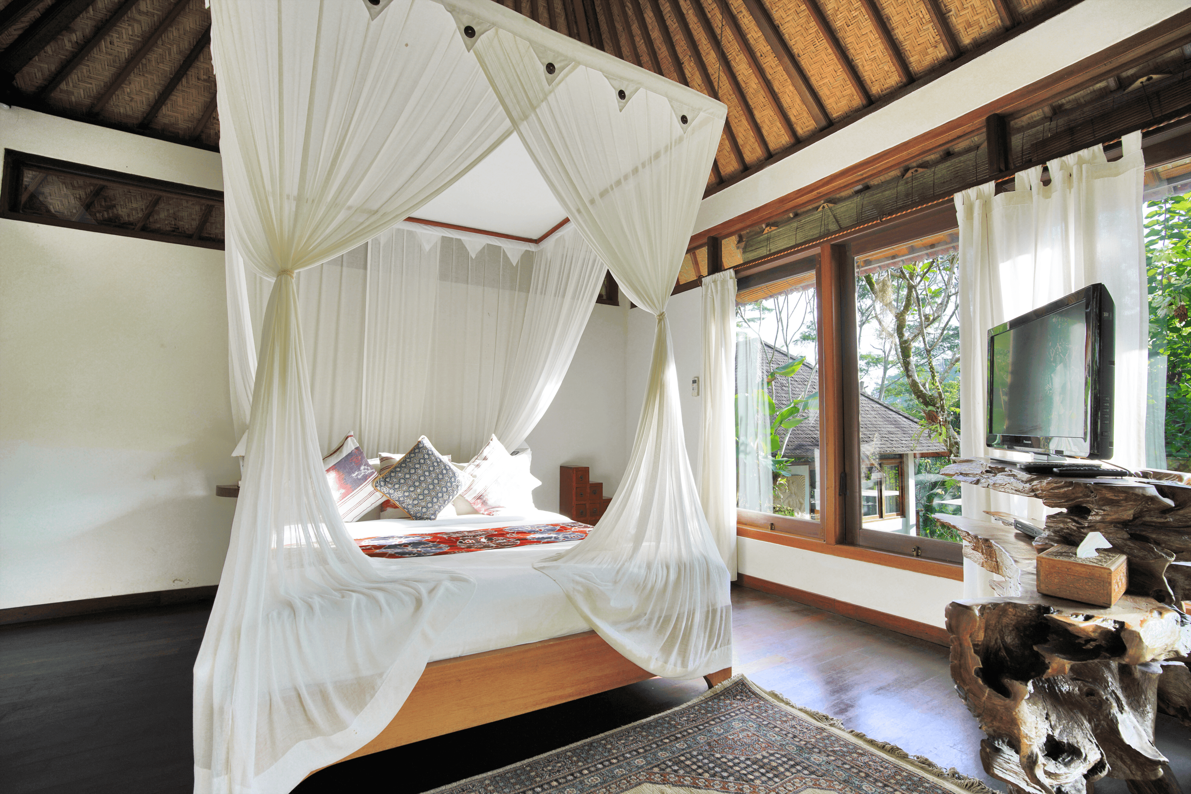 Luxurious bedroom with white drapes